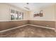 Dining room with neutral carpeting and an elegant lighting fixture, perfect for entertaining at 7950 E Lakeview Ave, Mesa, AZ 85209