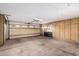 Spacious garage featuring storage cabinets and an insulated door for easy access and organization at 7950 E Lakeview Ave, Mesa, AZ 85209