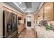 Kitchen showcasing stainless steel appliances, stone countertops and ample natural light at 7950 E Lakeview Ave, Mesa, AZ 85209