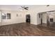 Bright living room featuring wood-look tile floors, natural light and an open concept design at 7950 E Lakeview Ave, Mesa, AZ 85209