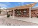 Covered patio with ceiling fan and brick exterior, perfect for outdoor living and entertaining at 7950 E Lakeview Ave, Mesa, AZ 85209