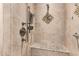 Walk-in shower with gray tile surround and a built-in shower bench at 7950 E Lakeview Ave, Mesa, AZ 85209
