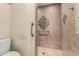 A tiled walk-in shower with grab bars for easy accessibility at 7950 E Lakeview Ave, Mesa, AZ 85209