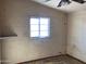 A small bedroom with a window and exposed brick walls at 844 S Macdonald --, Mesa, AZ 85210