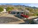 Single story home with mountain views and red flowers at 9217 E Calle De Las Brisas --, Scottsdale, AZ 85255