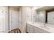 Elegant bathroom with double vanity and large mirror at 9699 S Mara Dr, Apache Junction, AZ 85120