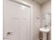 Small bathroom with pedestal sink and octagon mirror at 9699 S Mara Dr, Apache Junction, AZ 85120