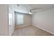 Bright bedroom with ceiling fan and neutral walls at 9699 S Mara Dr, Apache Junction, AZ 85120