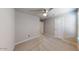 Spacious bedroom with ceiling fan and neutral decor at 9699 S Mara Dr, Apache Junction, AZ 85120