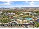 Community overview featuring a large pool, park, and surrounding neighborhood at 10037 E Rubidium Ave, Mesa, AZ 85212