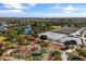 Aerial view of community park with lake, playground, and community gardens at 10037 E Rubidium Ave, Mesa, AZ 85212