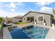 Inviting backyard oasis with a sparkling pool and patio furniture at 10037 E Rubidium Ave, Mesa, AZ 85212