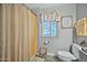 Bathroom with toilet, shower, and gray vanity with vessel sink at 10312 W Sierra Dawn Dr, Sun City, AZ 85351