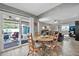 Bright dining area with wooden table and chairs, kitchen view at 10312 W Sierra Dawn Dr, Sun City, AZ 85351