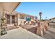 Front entry with double doors, stone pathway, and potted plants at 10312 W Sierra Dawn Dr, Sun City, AZ 85351