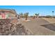 Landscaped front yard with gravel and mature tree at 10312 W Sierra Dawn Dr, Sun City, AZ 85351