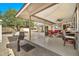 Covered patio features seating area and ceiling fan at 10312 W Sierra Dawn Dr, Sun City, AZ 85351