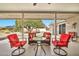 Covered patio with seating area and ceiling fan at 10312 W Sierra Dawn Dr, Sun City, AZ 85351