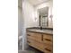 Modern bathroom with light wood vanity and floating sink at 10598 E Fernwood Ln, Scottsdale, AZ 85262