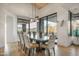 Bright dining room with mountain views and a large table at 10598 E Fernwood Ln, Scottsdale, AZ 85262