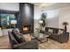 Living room with fireplace and comfortable seating area at 10598 E Fernwood Ln, Scottsdale, AZ 85262