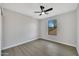 Spacious bedroom with wood-look floors, a window, and ceiling fan at 1126 E San Remo Ave, Gilbert, AZ 85234