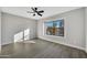 Well-lit bedroom with large window and ceiling fan at 1126 E San Remo Ave, Gilbert, AZ 85234