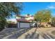 Two-story house with white exterior, attached garage, and gated driveway at 1126 E San Remo Ave, Gilbert, AZ 85234