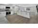 Modern kitchen with white cabinets, gray countertops and island at 1126 E San Remo Ave, Gilbert, AZ 85234