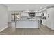 Modern kitchen with white cabinets, gray countertops and island at 1126 E San Remo Ave, Gilbert, AZ 85234