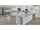 Modern kitchen with white cabinets, gray countertops and island at 1126 E San Remo Ave, Gilbert, AZ 85234