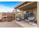 Backyard patio with seating area and grill at 11608 W Oglesby Ave, Youngtown, AZ 85363