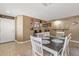 Charming dining area with a rustic wooden table and a view of the entryway at 11608 W Oglesby Ave, Youngtown, AZ 85363