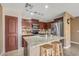 Kitchen with granite countertops, stainless steel appliances, and an island at 11608 W Oglesby Ave, Youngtown, AZ 85363