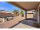 Spacious backyard with covered patio and gravel landscaping at 12838 N 148Th Ln, Surprise, AZ 85379