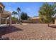 Large backyard with gravel and a patio area at 12838 N 148Th Ln, Surprise, AZ 85379