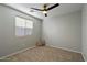 Bright and airy bedroom with neutral walls and carpeted floor at 12838 N 148Th Ln, Surprise, AZ 85379