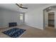 Bedroom with ceiling fan, window, and walk-in closet at 12838 N 148Th Ln, Surprise, AZ 85379