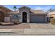 Single-story home with a two-car garage and desert landscaping at 12838 N 148Th Ln, Surprise, AZ 85379