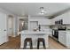 Kitchen island with white cabinets and quartz countertop at 12838 N 148Th Ln, Surprise, AZ 85379