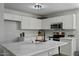 Modern kitchen with white cabinets and quartz countertops at 12838 N 148Th Ln, Surprise, AZ 85379