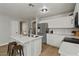 Modern kitchen featuring white cabinets, a large island, and stainless steel appliances at 12838 N 148Th Ln, Surprise, AZ 85379