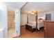 View of the bedroom and ensuite bathroom with a tiled shower and stone floor detail at 14019 N 51St Dr, Glendale, AZ 85306