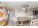 Dining room features a ceiling fan and connects to the adjacent living spaces at 14019 N 51St Dr, Glendale, AZ 85306