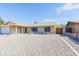 Single-story home showcasing its well-maintained gravel front yard and appealing facade at 14019 N 51St Dr, Glendale, AZ 85306