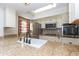 Granite countertops accent this kitchen, stainless steel appliances, and bright natural light at 14019 N 51St Dr, Glendale, AZ 85306