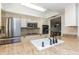 Close-up of the kitchen showcasing stainless steel appliances and white cabinetry at 14019 N 51St Dr, Glendale, AZ 85306