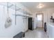 Laundry room featuring tiled floors, shelving, and appliances at 14019 N 51St Dr, Glendale, AZ 85306