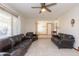 Spacious living area featuring tile floors, comfortable furniture and bright windows at 14019 N 51St Dr, Glendale, AZ 85306