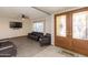 Inviting living room featuring tile floors, ceiling fan, and a warm seating arrangement at 14019 N 51St Dr, Glendale, AZ 85306